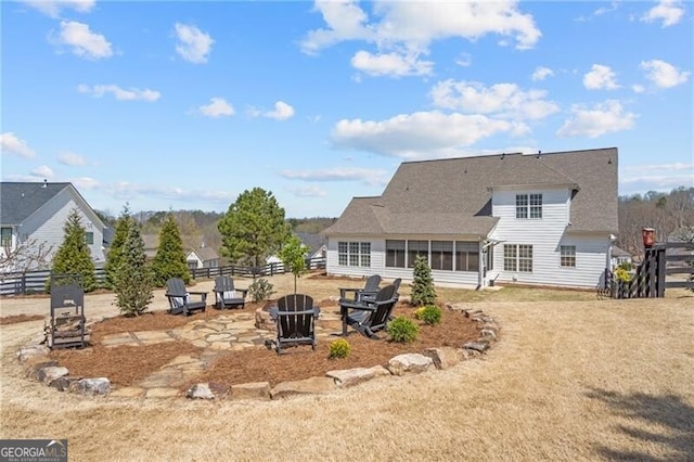 200 Ivy Meadow Way, Ball Ground, GA 30107 - rear view of property with a fire pit, a sunroom, and a shingled roof