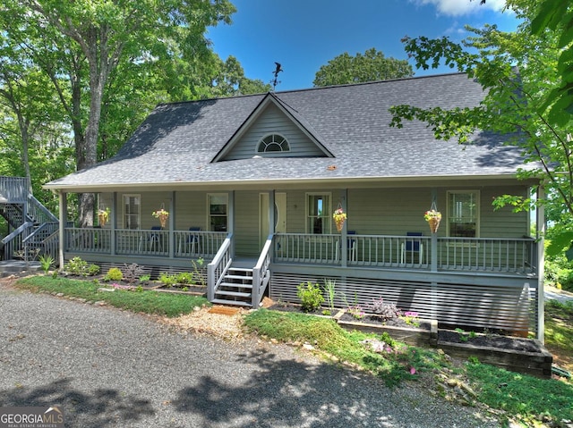 312 Mollie Mountain Trl, Ellijay, GA 30536 - view of side of home with stairway, gravel driveway, and roof with shingles