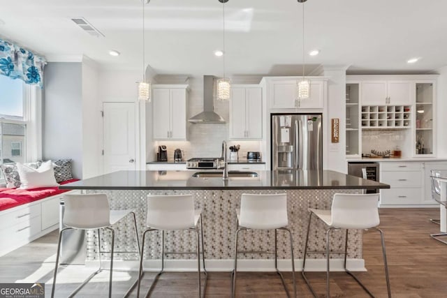 1621 Wellborn Walk, Suwanee, GA 30024 - kitchen featuring wall chimney exhaust hood, stainless steel fridge with ice dispenser, wine cooler, tasteful backsplash, and dark countertops