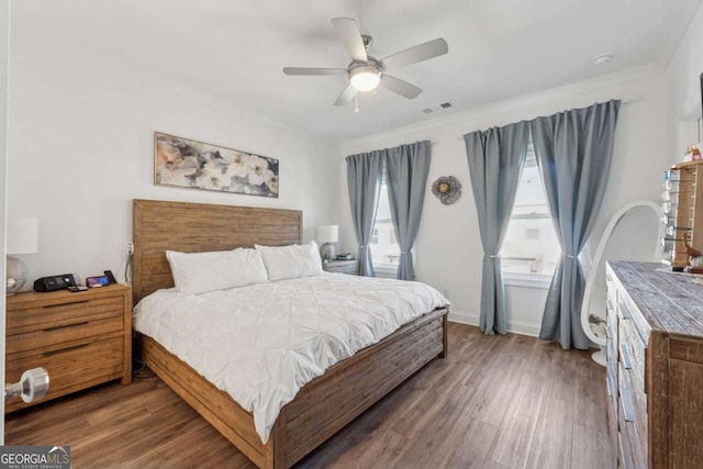 1621 Wellborn Walk, Suwanee, GA 30024 - bedroom with wood finished floors, ceiling fan, and crown molding