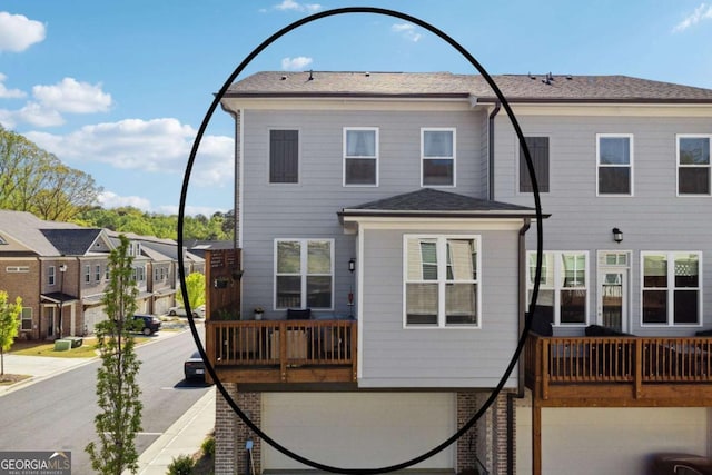 1621 Wellborn Walk, Suwanee, GA 30024 - back of house with a garage, a residential view, roof with shingles, and a balcony