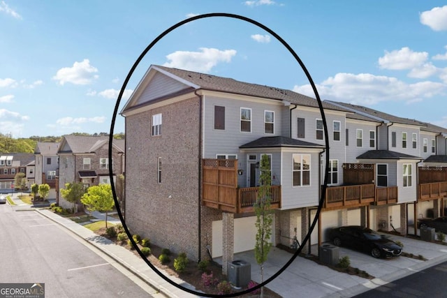 1621 Wellborn Walk, Suwanee, GA 30024 - view of property featuring a residential view, brick siding, and a garage