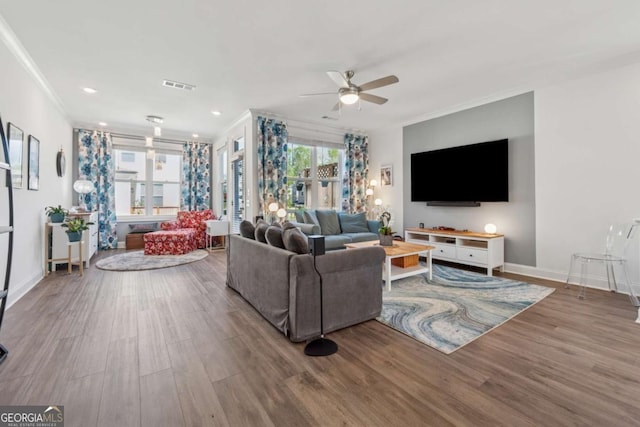 1621 Wellborn Walk, Suwanee, GA 30024 - living room featuring a ceiling fan, wood finished floors, crown molding, and recessed lighting