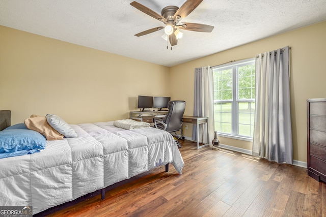 107 Line Creek Rd, Nicholson, GA 30565 - bedroom with wood finished floors, a textured ceiling, and ceiling fan