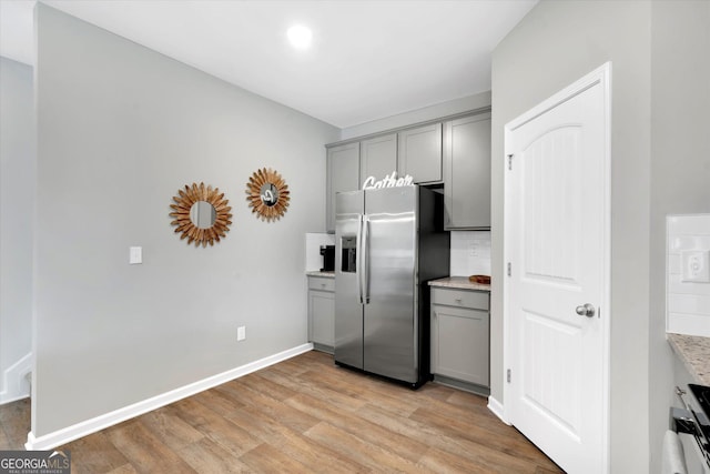 217 Rusty Plow Ln Unit 68, Perry, GA 31069 - kitchen featuring stainless steel refrigerator with ice dispenser, gray cabinets, light wood-type flooring, and tasteful backsplash