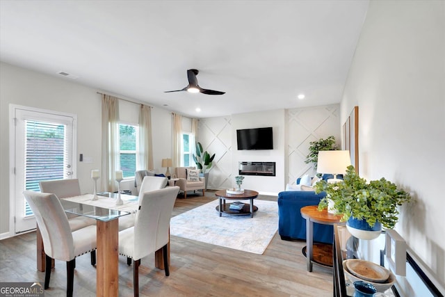 217 Rusty Plow Ln Unit 68, Perry, GA 31069 - dining space featuring wood finished floors, a ceiling fan, a glass covered fireplace, and recessed lighting