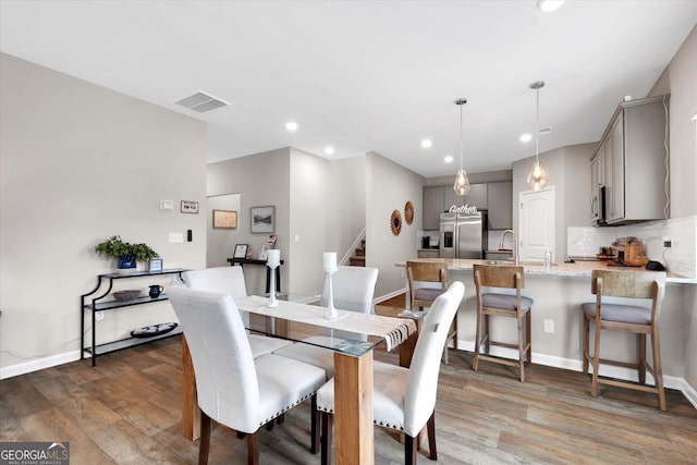 217 Rusty Plow Ln Unit 68, Perry, GA 31069 - dining room featuring wood finished floors, recessed lighting, and stairs