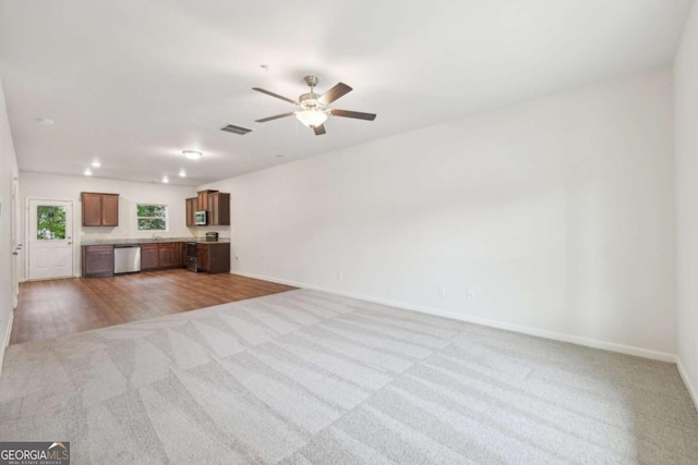 4001 Avalon Rd SW, Atlanta, GA 30331 - unfurnished living room with carpet floors, a ceiling fan, and recessed lighting