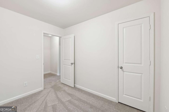 4001 Avalon Rd SW, Atlanta, GA 30331 - unfurnished bedroom featuring light colored carpet and baseboards