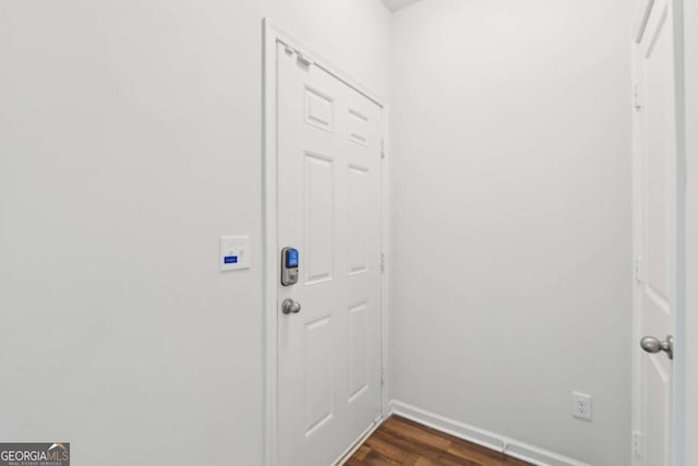 4001 Avalon Rd SW, Atlanta, GA 30331 - doorway to outside featuring dark wood-type flooring and baseboards