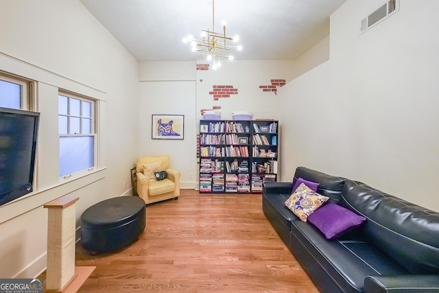 1026 Saint Charles Ave NE Unit 15, Atlanta, GA 30306 - sitting room with wood finished floors and a chandelier