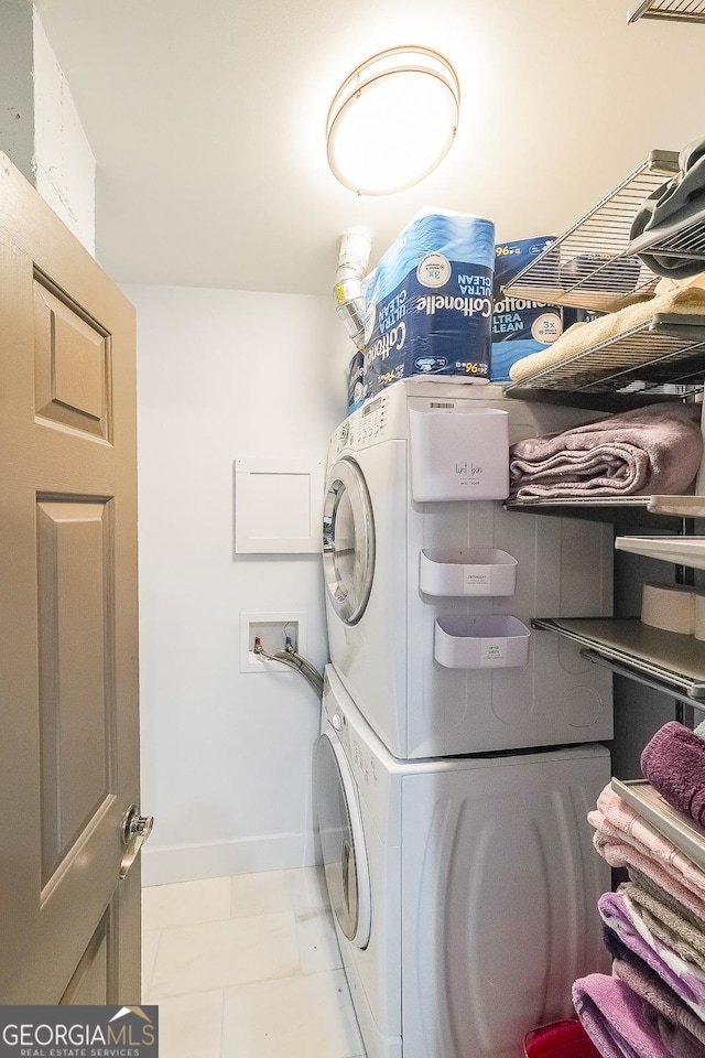 1026 Saint Charles Ave NE Unit 15, Atlanta, GA 30306 - laundry area with estacked washer and dryer and baseboards