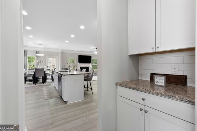 140 Canyons Ct, Hampton, GA 30228 - kitchen featuring recessed lighting, a ceiling fan, white cabinetry, dark stone counters, and open floor plan