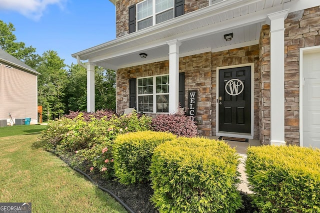 140 Canyons Ct, Hampton, GA 30228 - entrance to property with stone siding, a porch, and a lawn