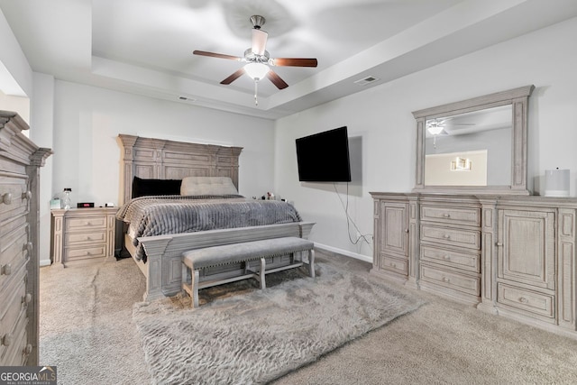 140 Canyons Ct, Hampton, GA 30228 - carpeted bedroom with a raised ceiling and ceiling fan
