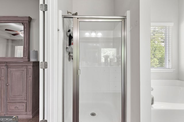 140 Canyons Ct, Hampton, GA 30228 - full bath featuring a stall shower, a bath, and a ceiling fan