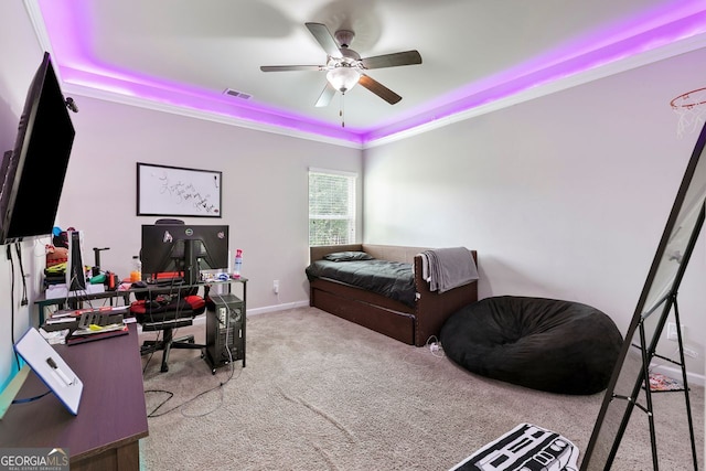 140 Canyons Ct, Hampton, GA 30228 - carpeted bedroom with a tray ceiling, an office area, and a ceiling fan