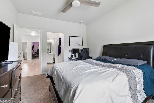140 Canyons Ct, Hampton, GA 30228 - bedroom with light colored carpet, ceiling fan, and ensuite bathroom