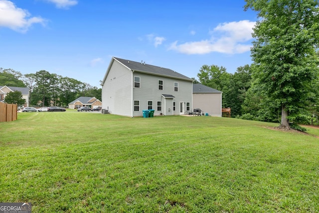 140 Canyons Ct, Hampton, GA 30228 - rear view of house with a lawn