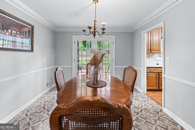564 Allana Ct, Stone Mountain, GA 30087 - dining room with a chandelier, ornamental molding, and light floors