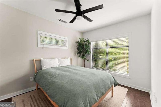 19 Moda Ln, Atlanta, GA 30316 - bedroom with multiple windows, wood finished floors, and ceiling fan
