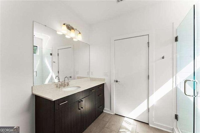 19 Moda Ln, Atlanta, GA 30316 - bathroom featuring vanity, a stall shower, and tile patterned floors