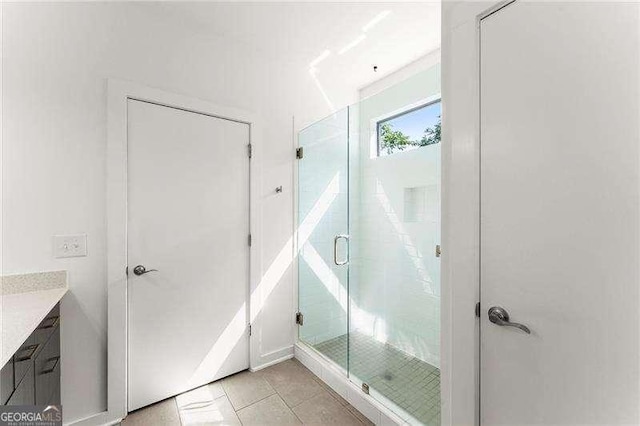 19 Moda Ln, Atlanta, GA 30316 - full bathroom with vanity, a stall shower, and tile patterned floors