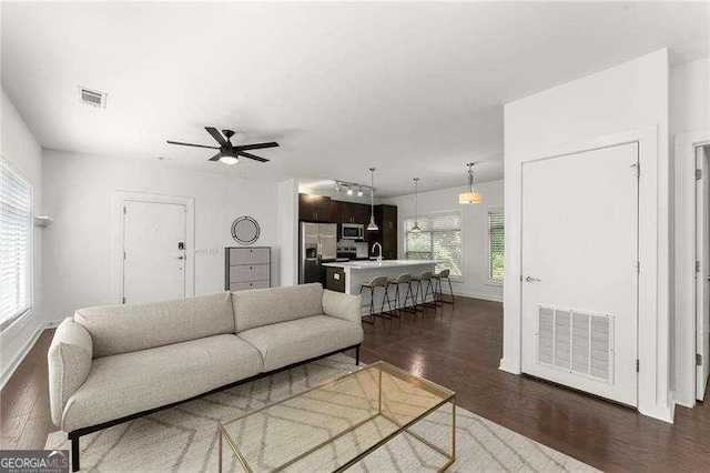 19 Moda Ln, Atlanta, GA 30316 - living room featuring healthy amount of natural light, dark wood finished floors, and ceiling fan