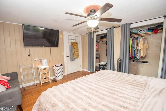 6110 Ga Highway 34, Franklin, GA 30217 - bedroom featuring wood finished floors, ceiling fan, and wooden walls