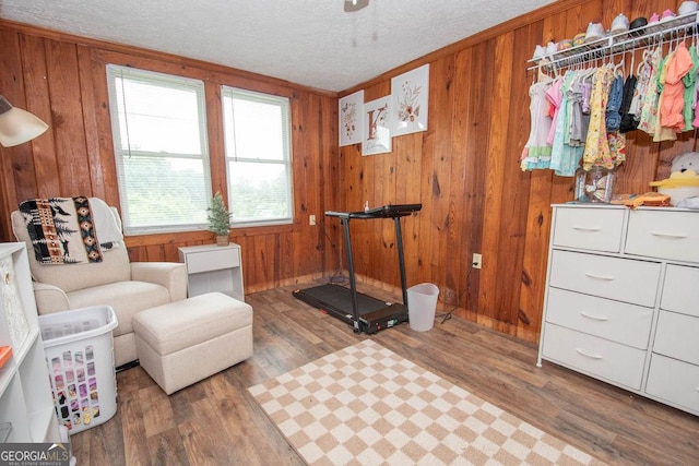 6110 Ga Highway 34, Franklin, GA 30217 - living area with wooden walls, wood finished floors, and a textured ceiling