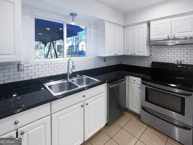 6220 Brookwood Rd, Peachtree Corners, GA 30092 - kitchen featuring appliances with stainless steel finishes, under cabinet range hood, dark countertops, and white cabinets