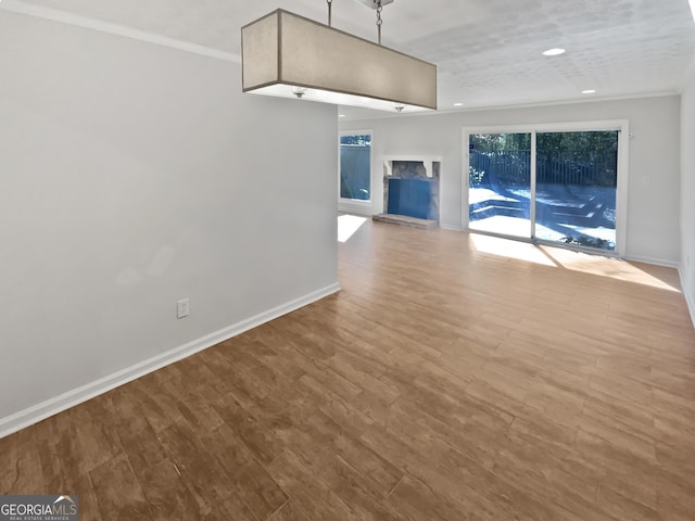 6220 Brookwood Rd, Peachtree Corners, GA 30092 - unfurnished living room featuring wood finished floors, recessed lighting, and ornamental molding