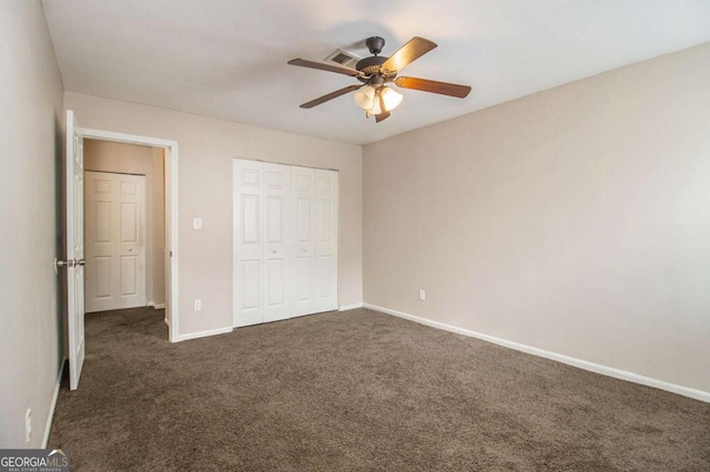 2039 Oak Park Ln, Decatur, GA 30032 - unfurnished bedroom with dark colored carpet, a closet, and ceiling fan