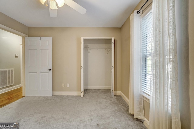 209 Jacobs Way Apt B, Jasper, GA 30143 - unfurnished bedroom featuring carpet, a closet, and a ceiling fan