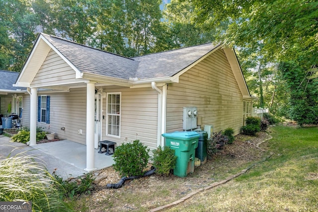 209 Jacobs Way Apt B, Jasper, GA 30143 - view of side of home with a shingled roof and a patio area