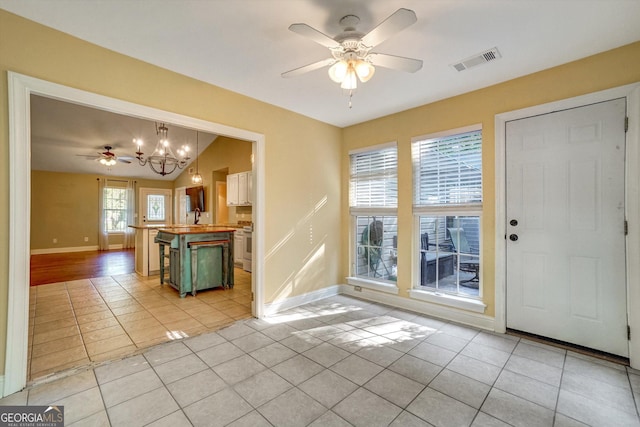 209 Jacobs Way Apt B, Jasper, GA 30143 - foyer with light tile patterned floors, ceiling fan, and a chandelier