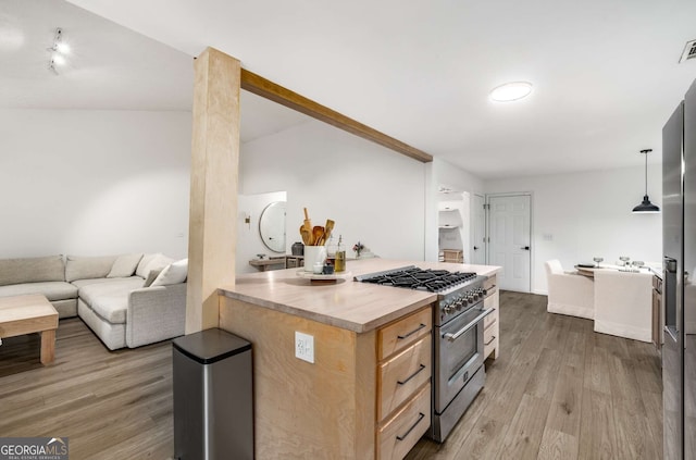 5315 Bentley Hall Dr, Alpharetta, GA 30005 - kitchen featuring stainless steel stove, light brown cabinets, wood finished floors, light countertops, and open floor plan