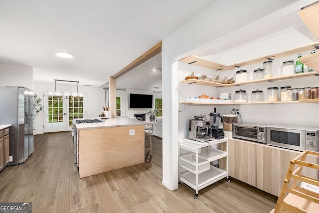5315 Bentley Hall Dr, Alpharetta, GA 30005 - kitchen with appliances with stainless steel finishes, light countertops, light wood-type flooring, and light brown cabinetry