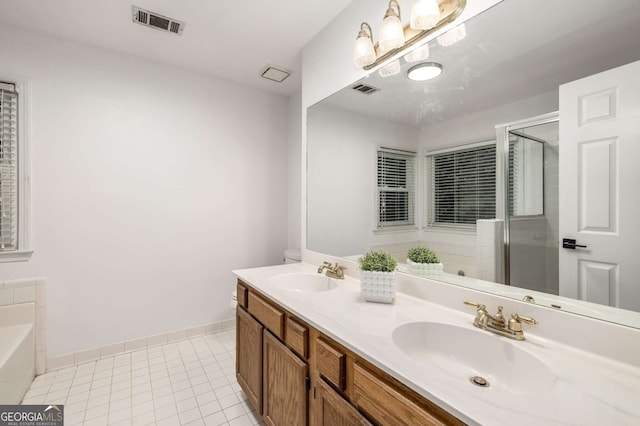 5315 Bentley Hall Dr, Alpharetta, GA 30005 - bathroom with double vanity, a garden tub, a stall shower, and tile patterned flooring