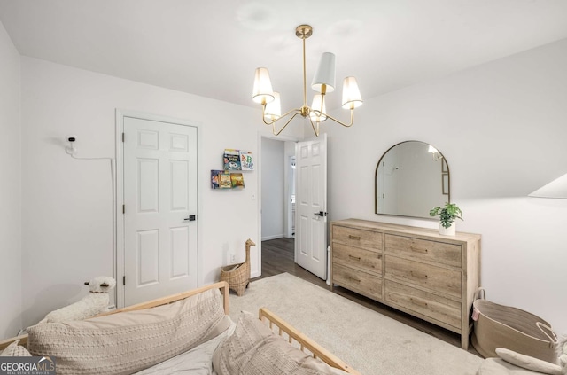 5315 Bentley Hall Dr, Alpharetta, GA 30005 - bedroom with a chandelier and wood finished floors