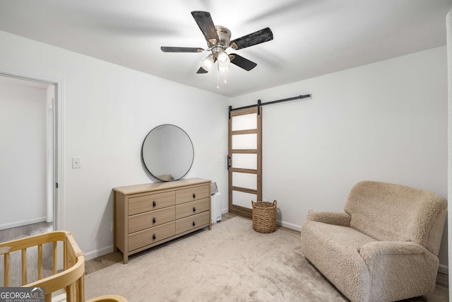 5315 Bentley Hall Dr, Alpharetta, GA 30005 - sitting room with a barn door and ceiling fan