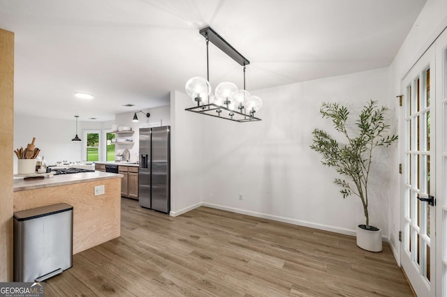 5315 Bentley Hall Dr, Alpharetta, GA 30005 - kitchen with stainless steel refrigerator with ice dispenser, a chandelier, light wood-style floors, and light countertops