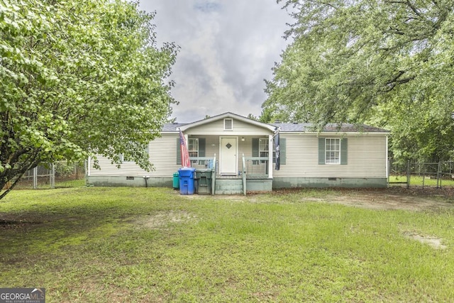 912 Druid St, Dublin, GA 31021 - manufactured / mobile home featuring crawl space, covered porch, and a shingled roof
