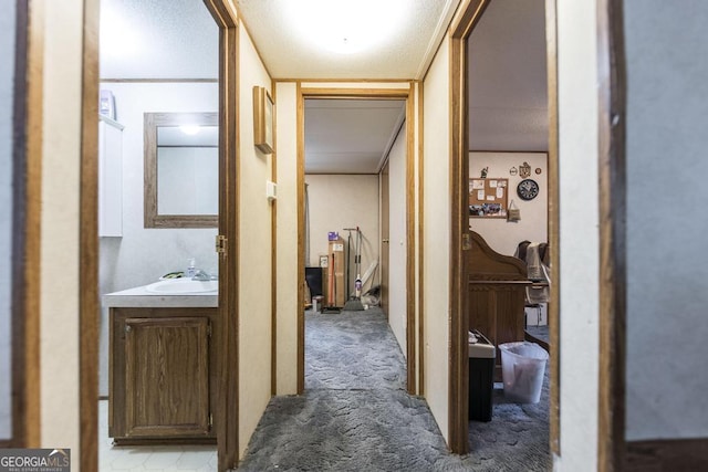 912 Druid St, Dublin, GA 31021 - corridor featuring carpet floors and a sink
