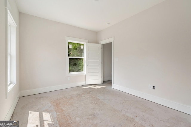 195 Grove Point Rd, Athens, GA 30605 - unfurnished room with baseboards and unfinished concrete flooring