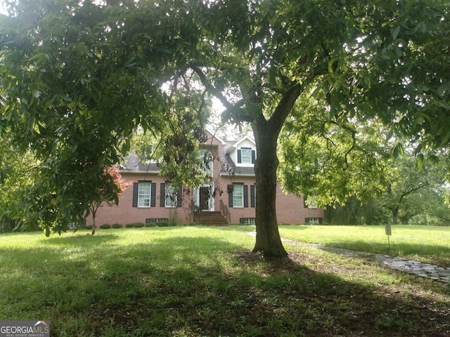 113 Heatherwood Ln, Barnesville, GA 30204 - obstructed view of property with a front lawn