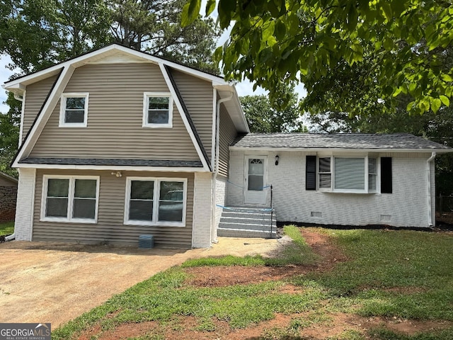 1094 SW Amber Rdg SW, Lilburn, GA 30047 - split level home featuring brick siding, crawl space, a front lawn, roof with shingles, and a gambrel roof