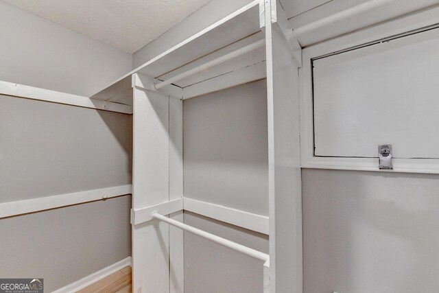 1094 SW Amber Rdg SW, Lilburn, GA 30047 - walk in closet with wood finished floors