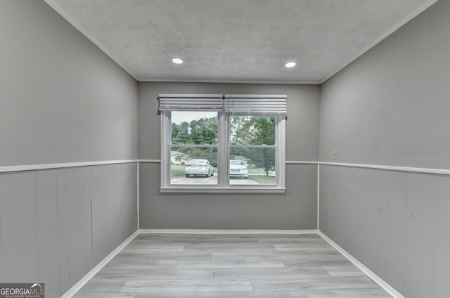 1094 SW Amber Rdg SW, Lilburn, GA 30047 - spare room with wood finished floors, a wainscoted wall, recessed lighting, and a textured ceiling