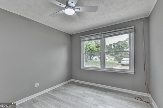 1094 SW Amber Rdg SW, Lilburn, GA 30047 - unfurnished room featuring a ceiling fan, a textured ceiling, light wood finished floors, and crown molding